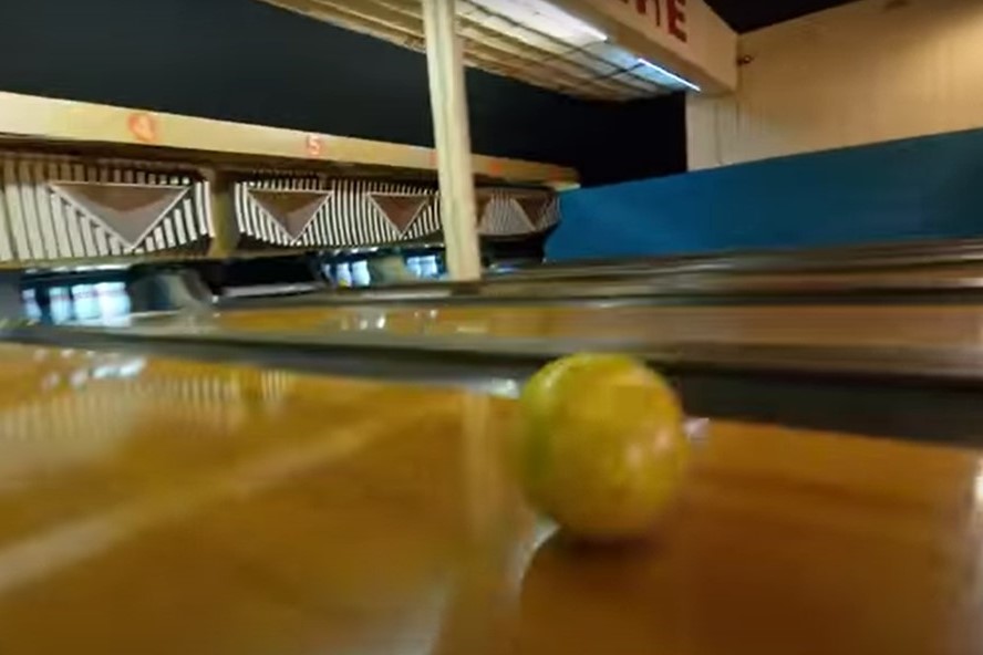 Drone flying through a bowling center